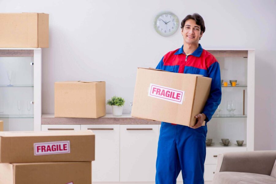 mover holding a box with a fragile label