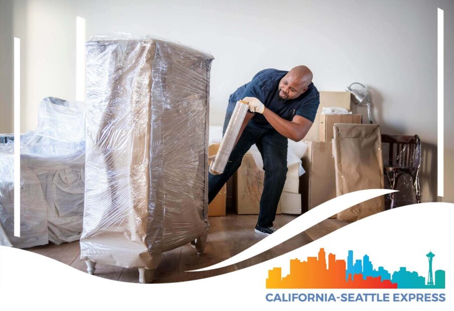 One of the cross-country movers moving packed furniture