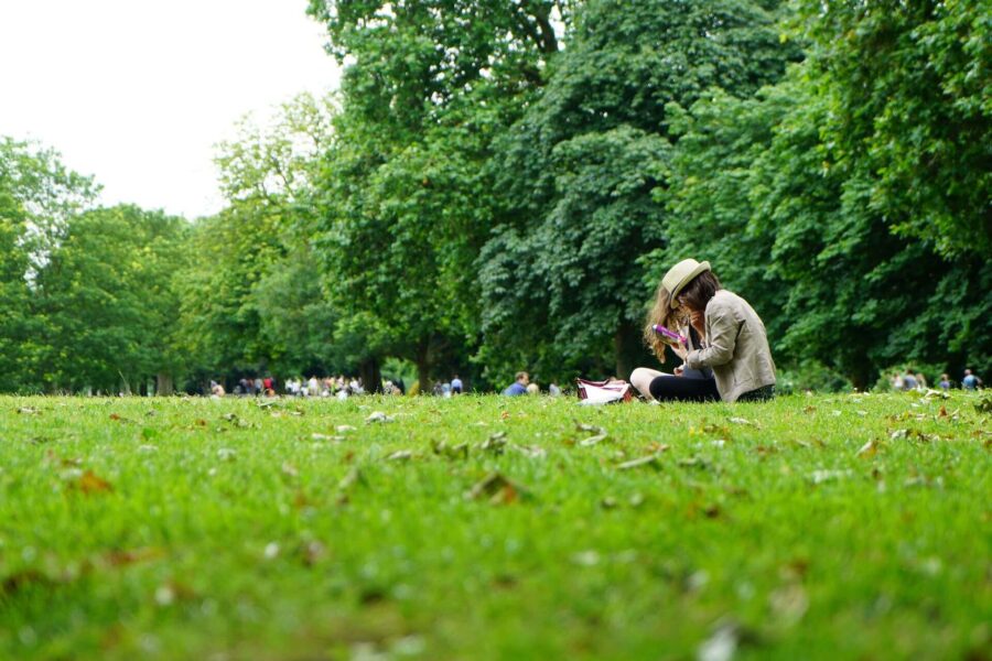Young people sitting on grass