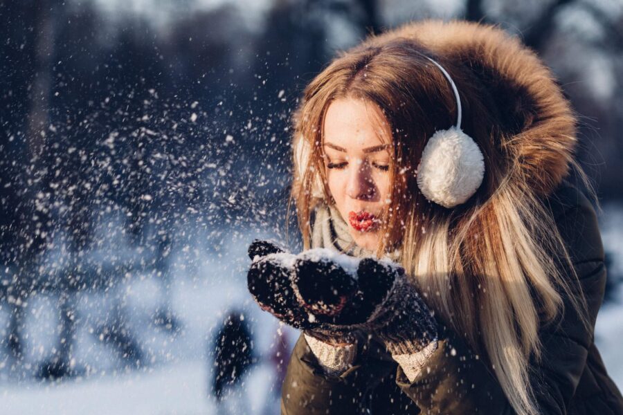 A girl playing with snow after long-distance moving