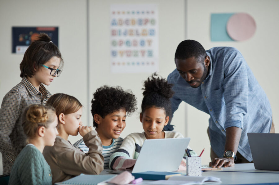 Kids and their teacher at school